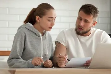 woman and man reviewing paperwork