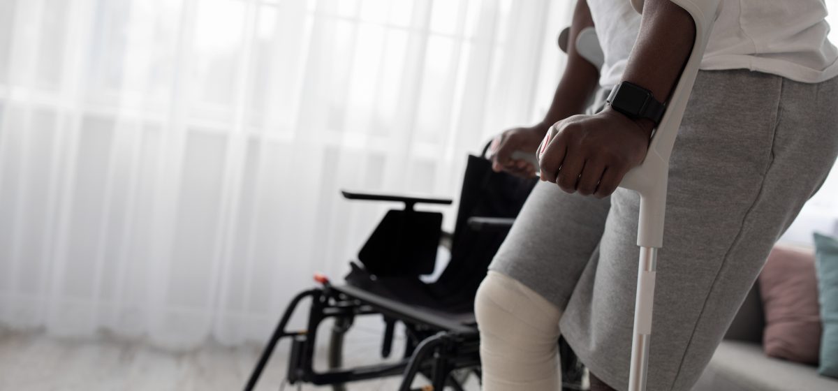 man with a cast on crutches