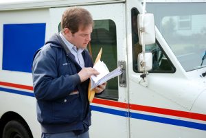 mail carrier sorting mail